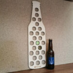 Rangement capsules de bière en forme d'une bouteille de bière