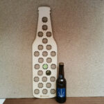 Rangement capsules de bière en forme d'une bouteille de bière