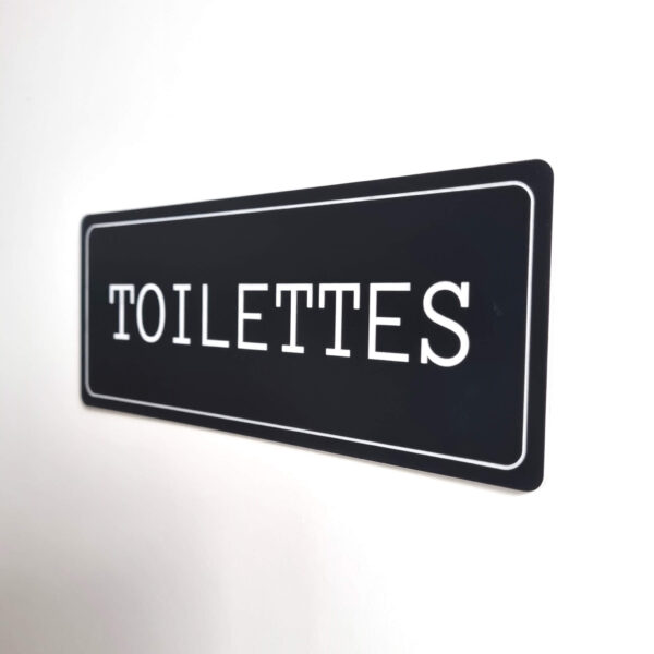 Plaque de porte toilettes en plastique de couleur noir fixation par adhésif